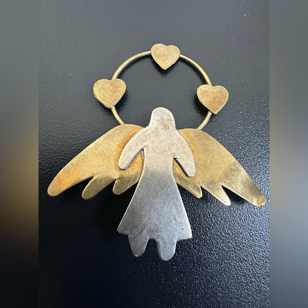 Vintage  mixed metal angel with a heart halo brooch
